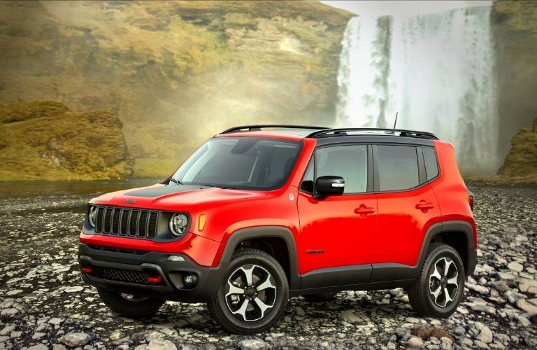 front quarter view of the 2022 Jeep Renegade with a waterfall in the background