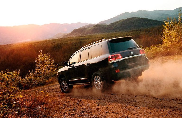 2016 Toyota Land Cruiser driving on a dusty road