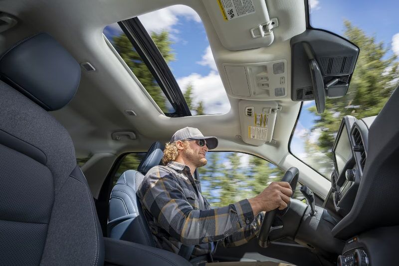 A man driving the 2024 Ford Bronco Sport with the moonroof open.