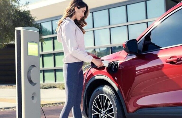 2025 Ford Escape Plug-In Hybrid with a woman
