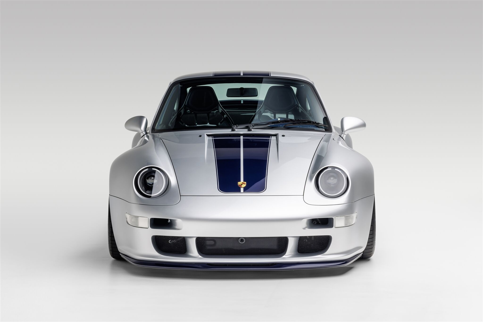 Porsche Coupe model front view on a white background