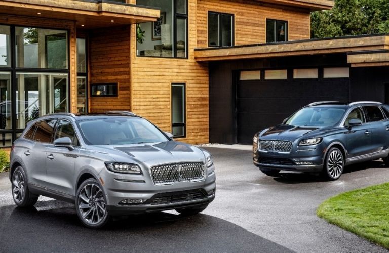 Lincoln Luxury Vehicles Parked Outside a Home