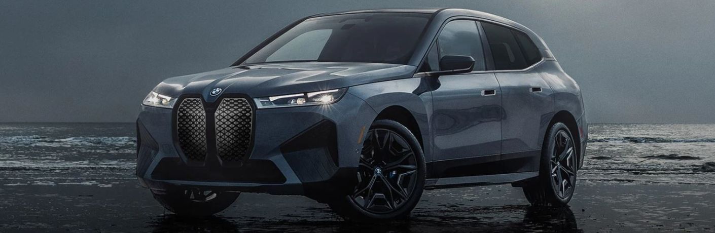 The side view of a grey 2022 BMW iX