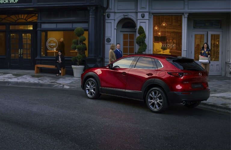 red mazda cx-30 parked on side of road