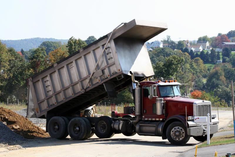 A pre-owned dump truck