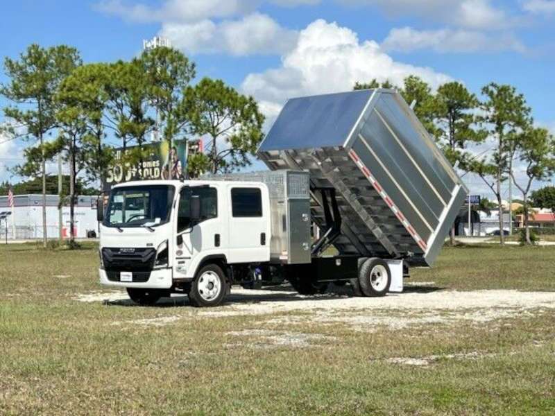 A side exterior view of an Isuzu small dump truck