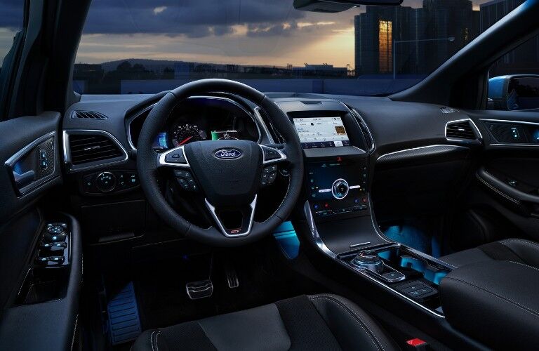 Front interior of the 2020 Ford Edge with blue ambient lighting