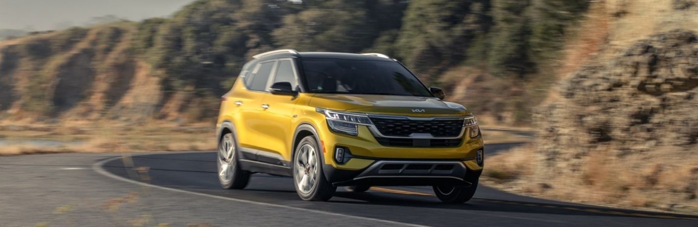 A 2022 Kia Seltos speeding on a road