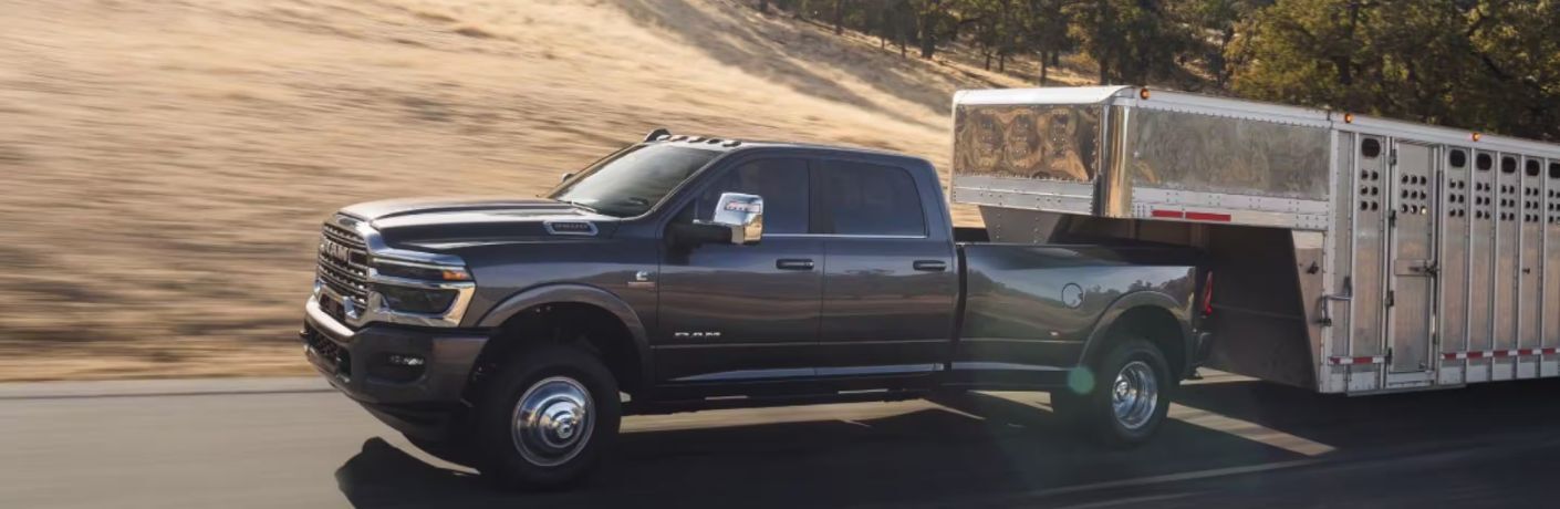 side view of the Ram 3500 Limited Longhorn towing a trailer