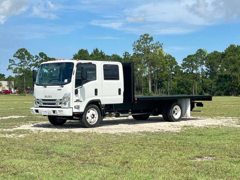 A side exterior view of a flatbed truck
