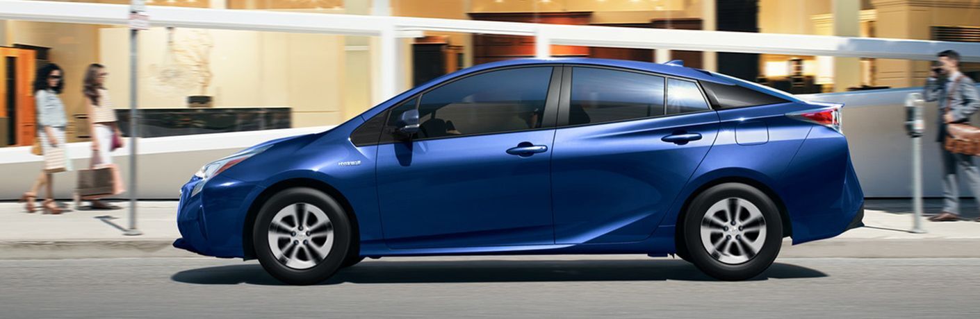 2018 Toyota Prius driving down the road