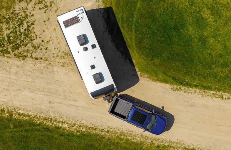 2026 Ford F-150 Lariat towing a trailer