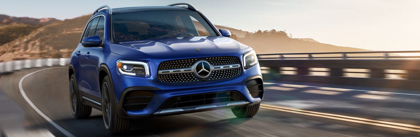 2023 Mercedes-Benz GLB 250 in Galaxy Blue speeding on the road