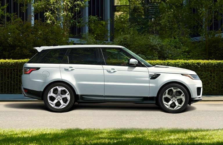 Land Rover Range Rover Sport parked outside near a lawn