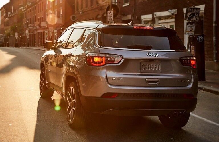 2021 Jeep Compass driving into the sunset