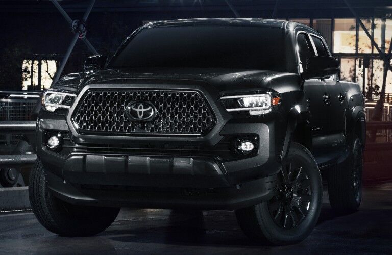 Driver's side front angle view of black 2021 Toyota Tacoma