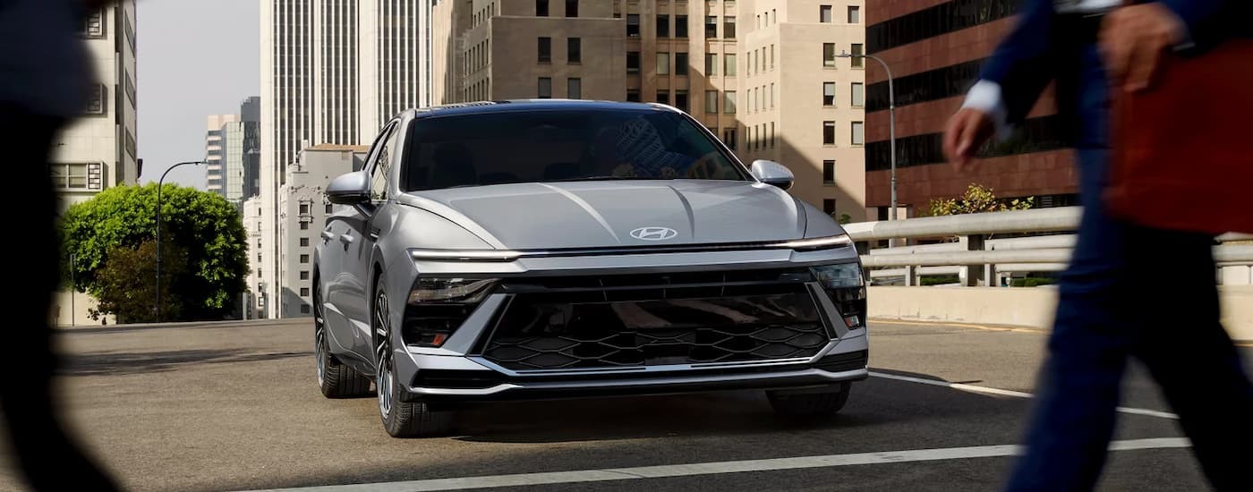 Silver 2024 Hyundai Elantra stopped at a crosswalk