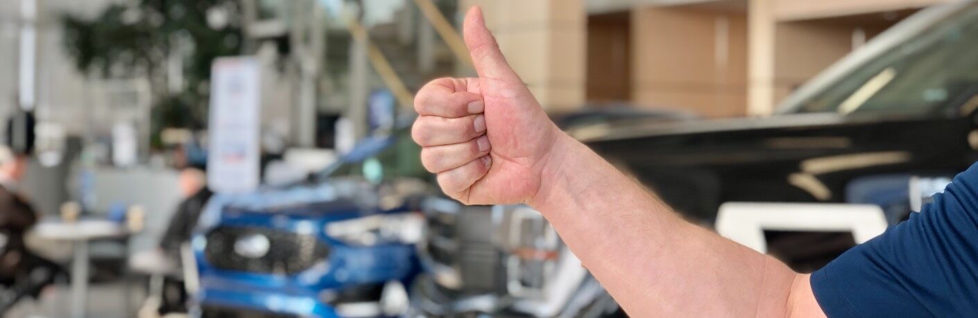 Thumbs up for a credit approval on a car loan in Ford Dealer Edmonton