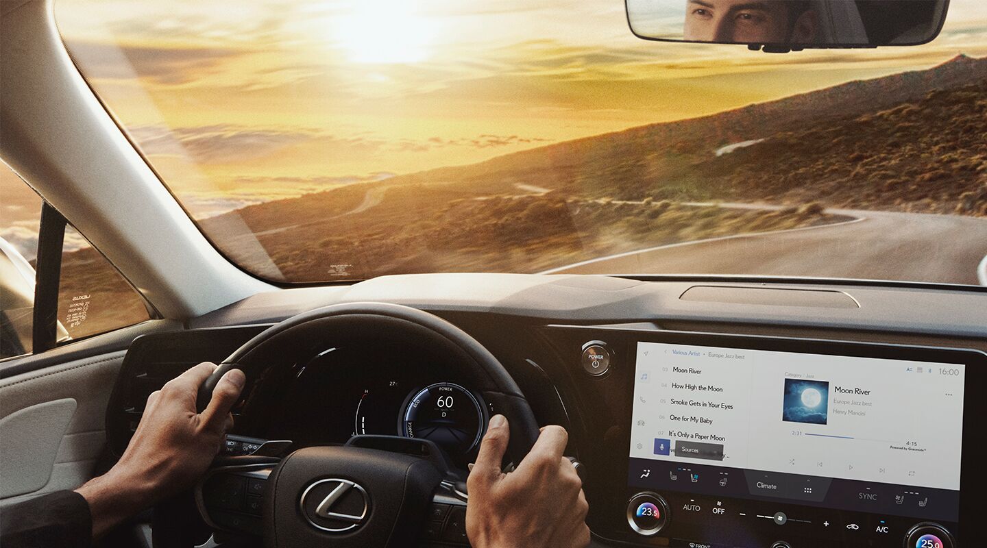 Man Standing next to 2023 Lexus RX