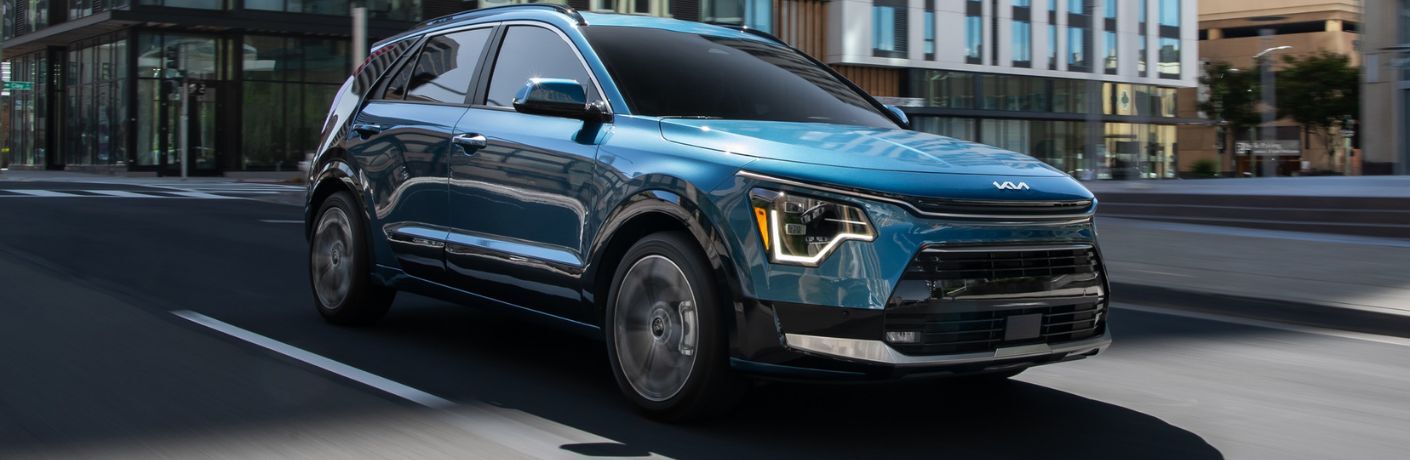 A 2024 Kia Niro Plug-In Hybrid on a city road