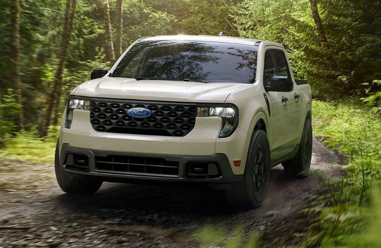 2025 Ford Maverick XLT front view in a forest