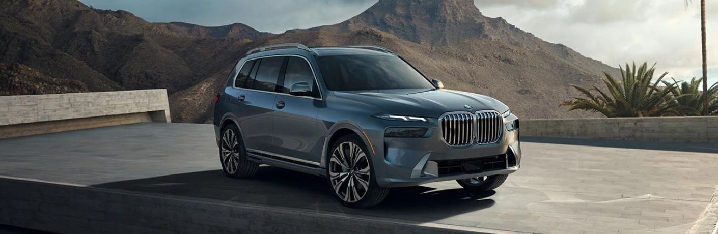 Front quarter view of a gray 2022 BMW X7 SUV parked outside
