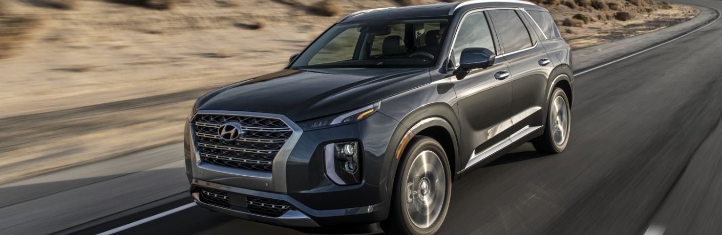 A 2020 Hyundai Palisade driving on the highway.