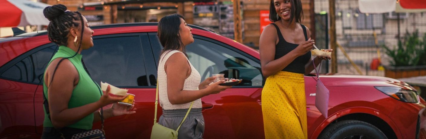 2025 Ford Escape with three people in a city