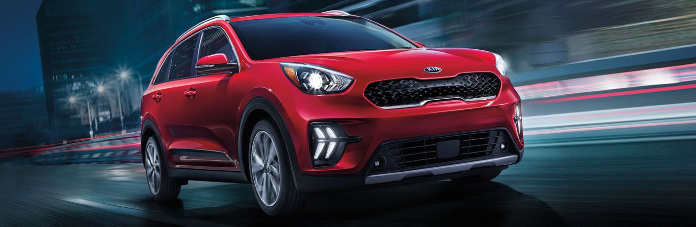 Red 2020 Kia Niro on a Freeway at Night