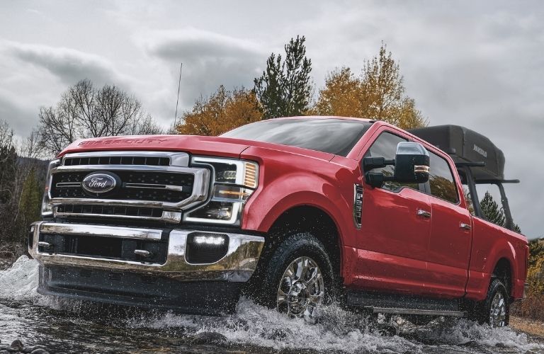 2022 Ford F-450 Super Duty Lariat crossing through a shallow water body