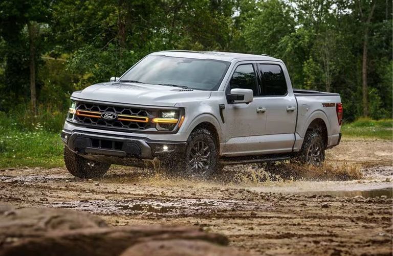 2025 Ford F-150 Tremor driving through mud
