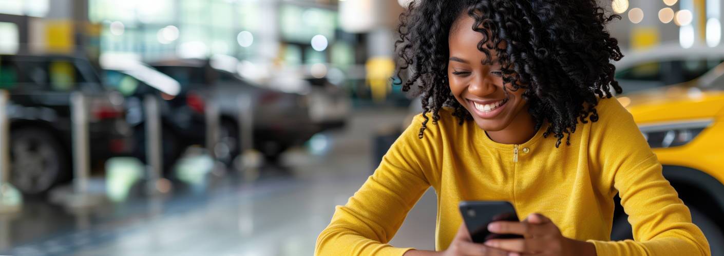 A woman applying for automotive credit in Edmonton,which well help to instantly start rebuilding her credit