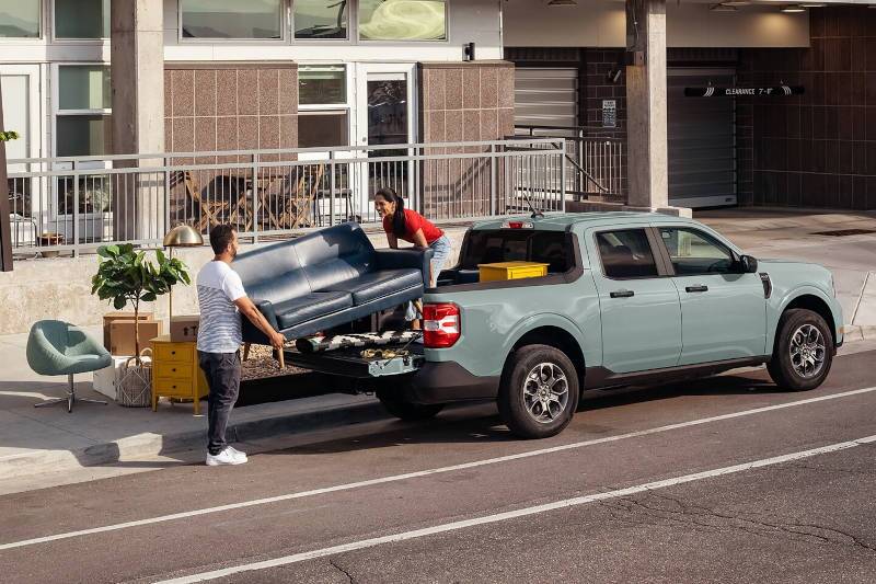 People loading furniture into a 2024 Ford Maverick near Atlanta.