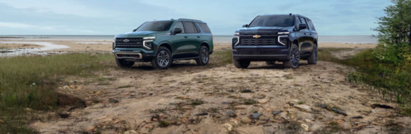 2025 Chevrolet Suburban SUVs on a beach