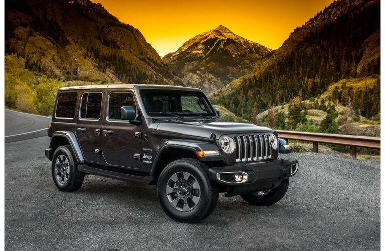 2021 Jeep Wrangler parked in front of a hill