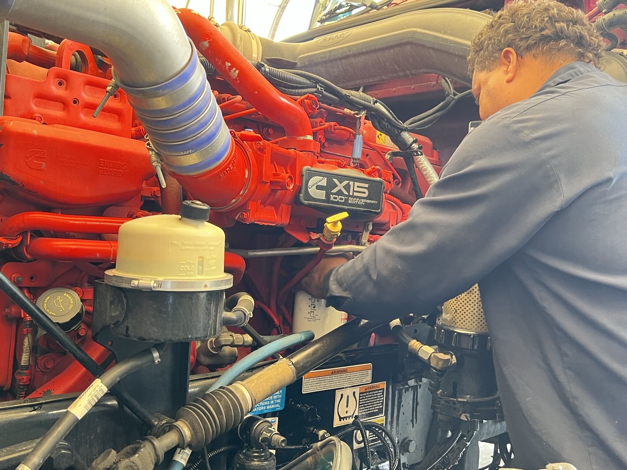 A man getting into a well-maintained commercial truck