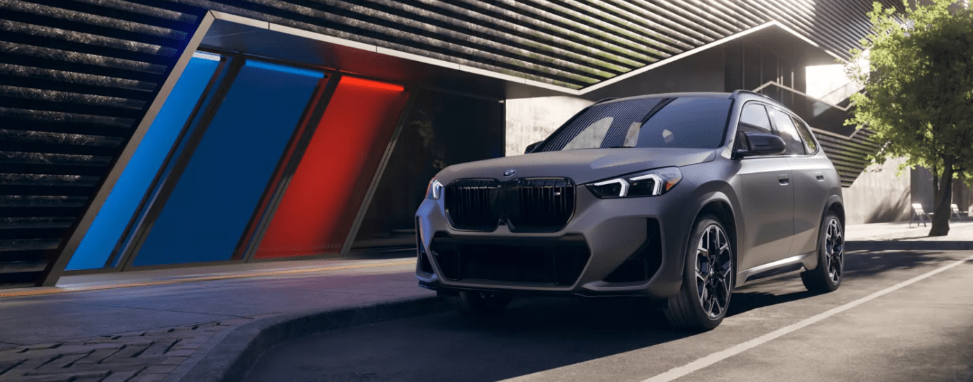 Silver 2026 BMW X1 M35i parked in front of a building
