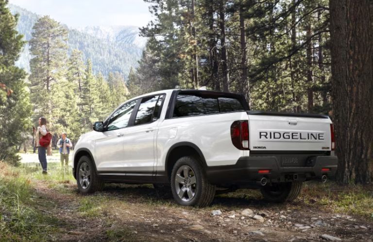 2024 Honda Ridgeline parked between the trees