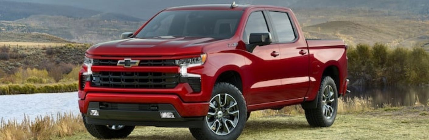 Front-side voew of the Used Chevrolet Silverado 1500 Red parked near lake