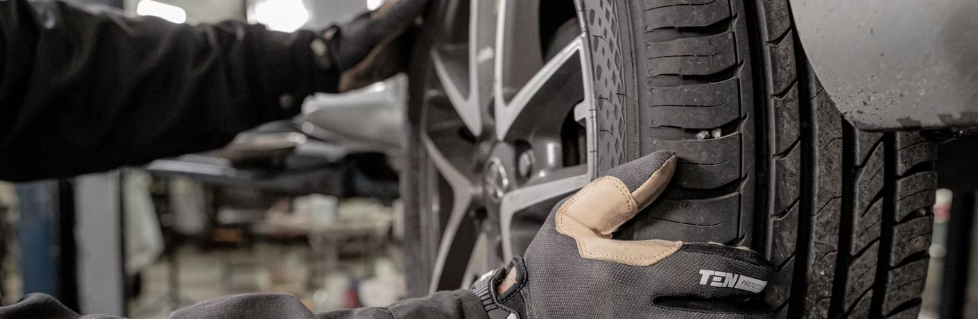 technician fixing a tire