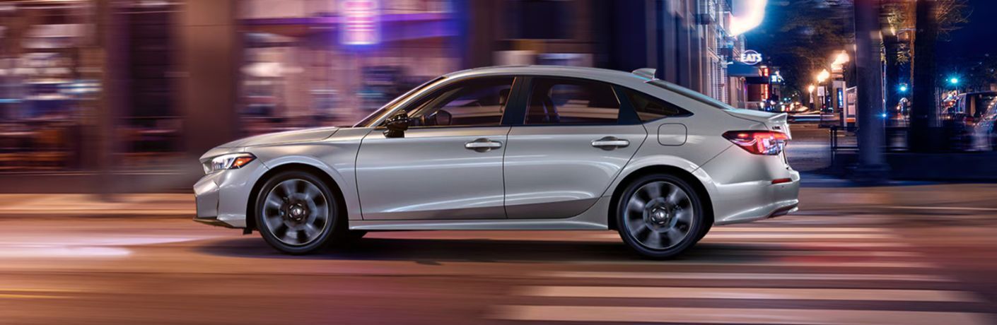 2026 Honda Civic side view in a city