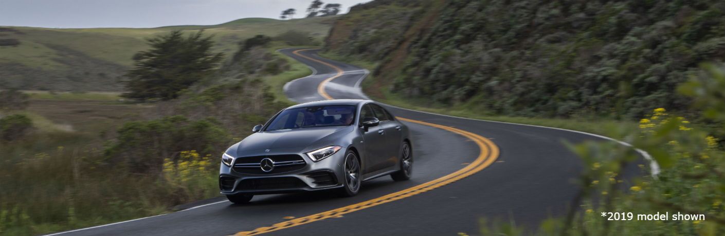 2020 MB CLS exterior front fascia and driver side going fast on blurred highway road