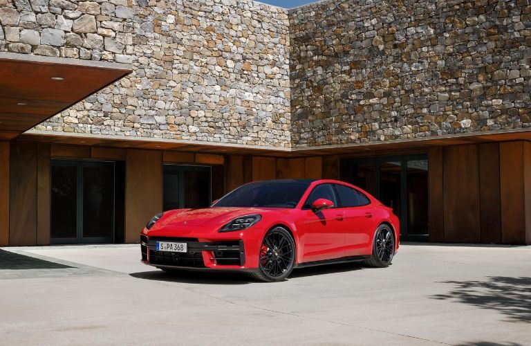 2025 Porsche Panamera parked outside a house