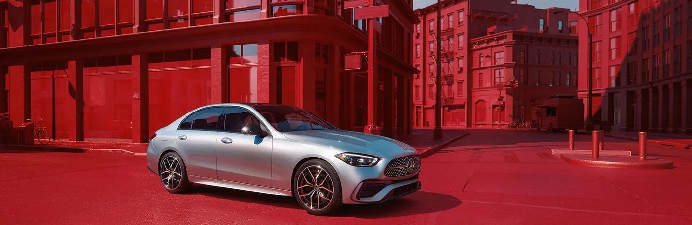 2024 Mercedes-Benz AMG C 43 4MATIC Sedan Gray driving on the road