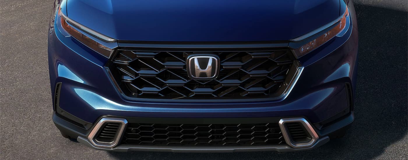 Grille and front of a blue used 2024 Honda CR-V for sale