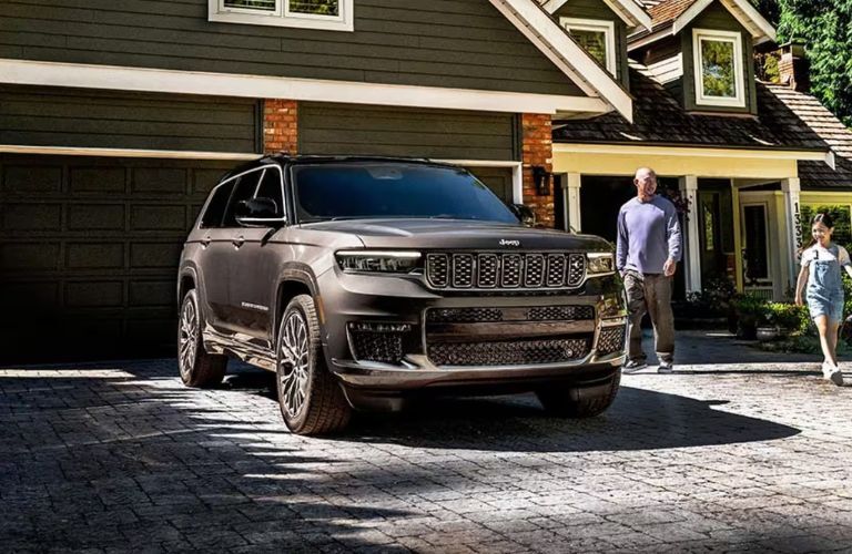 2025 Jeep Grand Cherokee parked outside a house