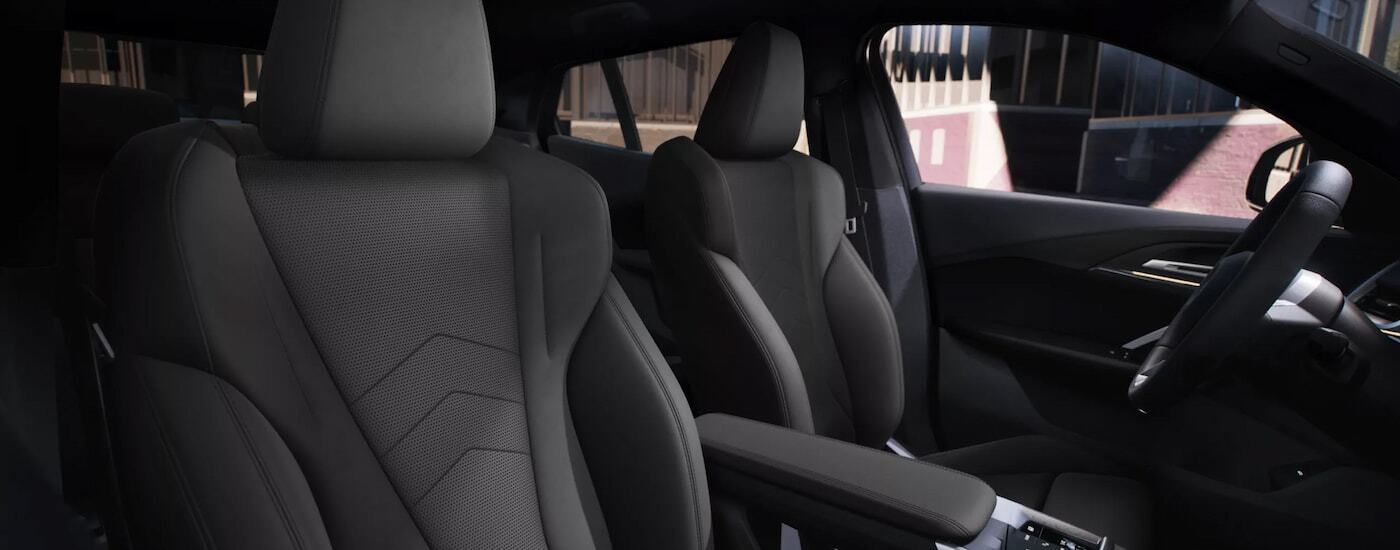 Red 2021 BMW M5 driving through and alleyway