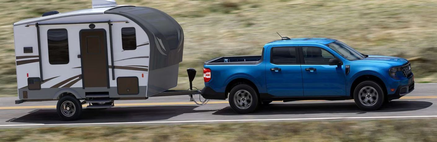 2025 Ford Maverick XLT side view towing a trailer