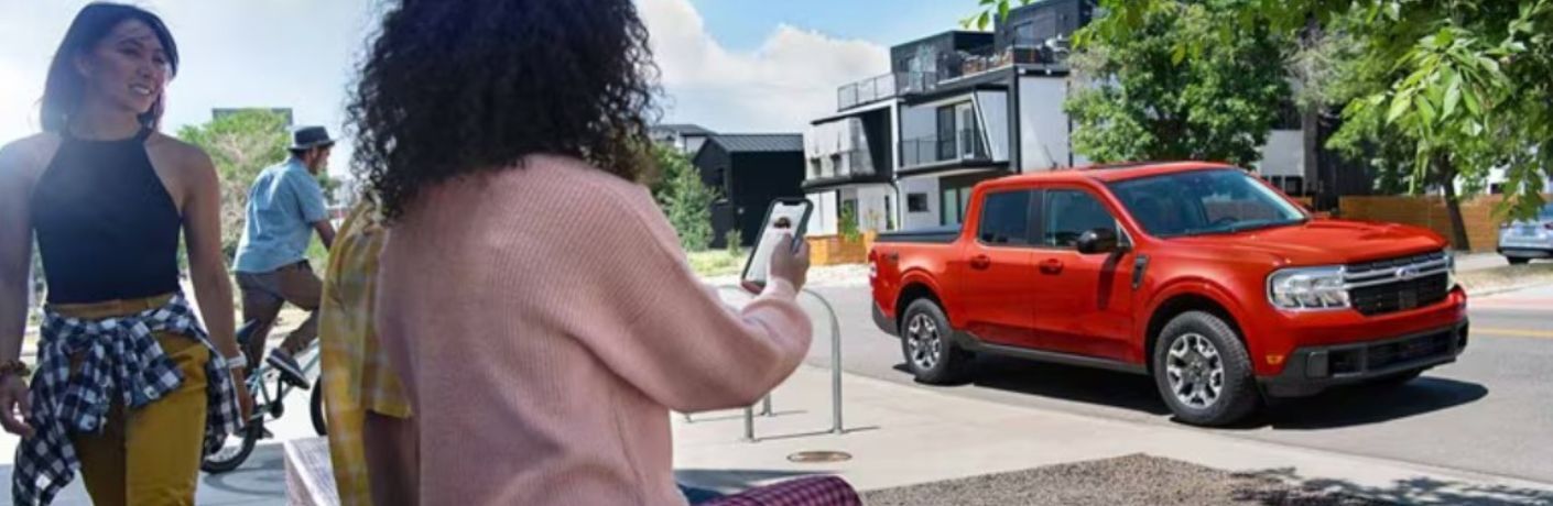 2024 Ford Maverick XL with three people nearby