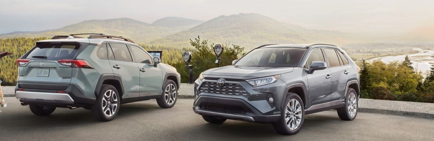 front and rear view of two SUVs